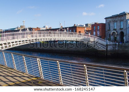 DUBLIN, IRELAND - NOVEMBER 11: the Ha\'penny Bridge over the River Liffey on November 11, 2013 in Dublin, Ireland. The Ha\'penny Bridge is a pedestrian bridge built in 1816 from cast iron.