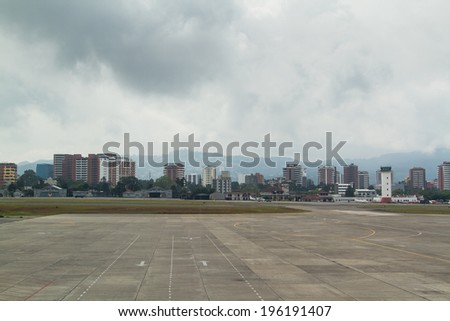 GUATEMALA CITY, GUATEMALA - MAY 08: Guatemala City airport with the city skyline on May 08, 2014 in Guatemala City, Guatemala.