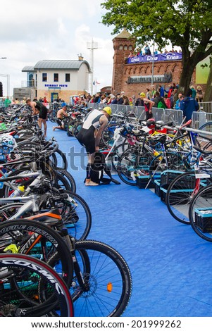 KOLOBRZEG, POLAND - JUNE 20: Transition zone of Triathlon event in Kolobrzeg, Poland on June 20, 2014. Bicycles waiting for triathletes.