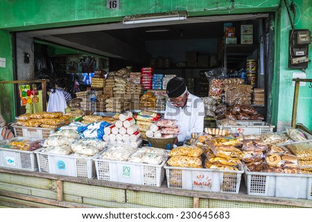 MALANG, WEST JAVA, INDONESIA - SEPTEMBER 18: Local men selling foods in Malang, Java, Indonesia on September 18, 2012.