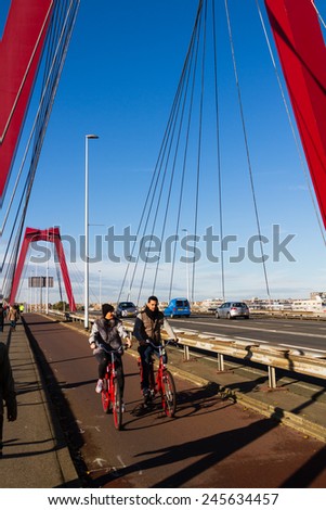 ROTTERDAM, NETHERLANDS - NOVEMBER 10: Willemsbrug bridge in Rotterdam, Netherlands on November 10, 2014. Cycling is very popular way of transport in Holland.