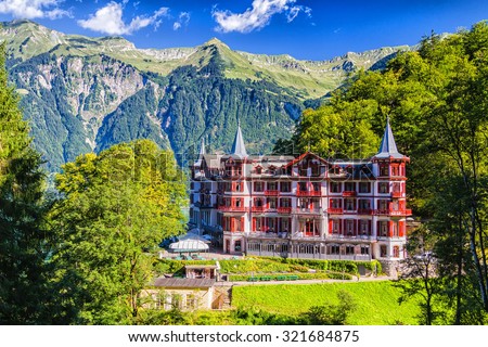 BRIENZ, SWITZERLAND - AUGUST 21: Grand Hotel Giessbach in Swiss Alps on August 21, 2014 in Brienz, Switzerland. Hotel is located next to the Giessbach waterfall.