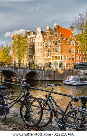 AMSTERDAM, THE NETHERLANDS - NOVEMBER 10: Bicycles lining a bridge over the canals in Amsterdam, The Netherlands on November 10, 2014.