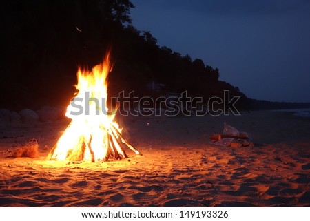 Inviting campfire on the beach in Michigan along Lake Michigan