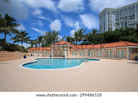 Upscale swimming pool and cabanas on Singer Island, in South Florida, USA