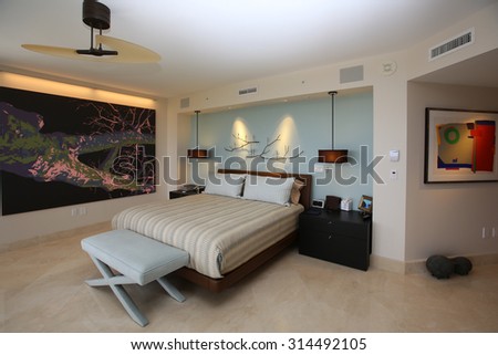 Inviting, upscale master bedroom in a high rise condominium.