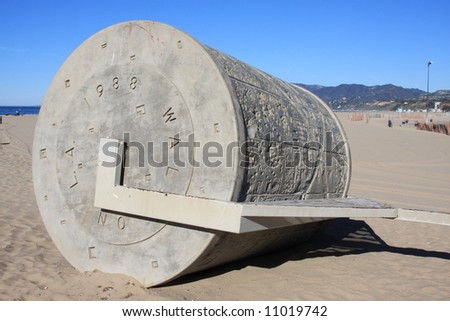 Large concrete roller device to create art in the sand on the beach in Santa Monica, California