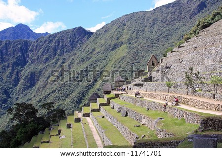 The Sun Gate and Andes Mountains at Machu Picchu, Lost City of the Incas in Peru