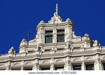 Classic French renaissance architecture on this glazed terra-cotta facade