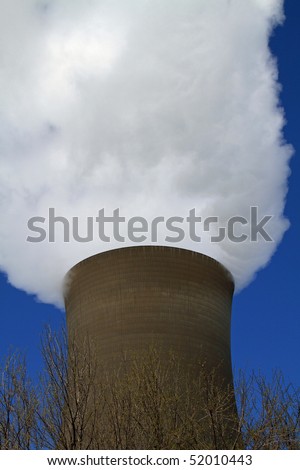 Dramatic smokes emerges from this coal fired power plant\'s massive chimney
