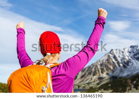 Hiking climbing woman and success in mountains, arms outstretched. Motivation and inspiration concept, Fitness and healthy lifestyle outdoors in wild nature