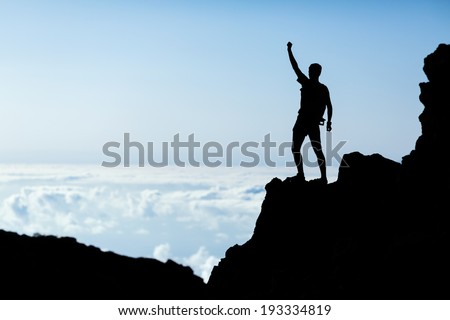 Hiking or running silhouette, man backpacker, success victory in mountains. Fitness and healthy lifestyle outdoors in summer nature on La Palma, Canary Islands