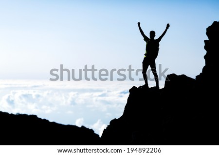 Successful hiking or trail running silhouette, man and success in mountains. Fitness and healthy lifestyle outdoors in summer nature on La Palma, Canary Islands