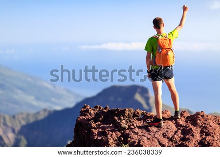 Hiker climber or trail cross country runner man and success in mountains. Fitness and healthy lifestyle outdoors in summer nature, climbing and mountaineering concept