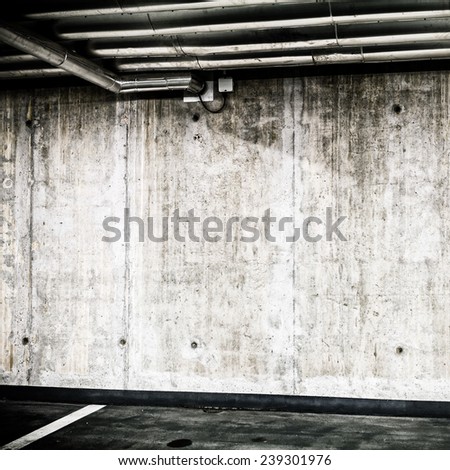 Concrete Wall Construction in Parking Garage Underground Interior background or texture. Concrete grunge wall, industrial retro vintage interior.