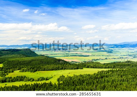 Summer landscape with green forest and beautiful inspirational landscape and mountains. Blue sky and white clouds, Poland Europe.