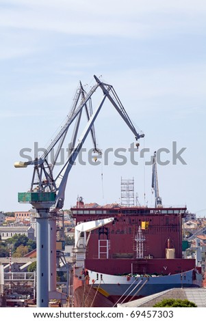 Empty cargo ship in harbor, industrial concept