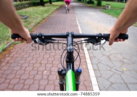 Bicycle path rider, motion blur, commuting to work