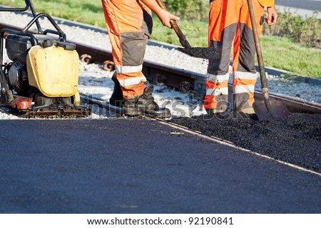 Road construction site, workers and teamwork