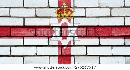 Northern Ireland flag painted on old brick wall texture background