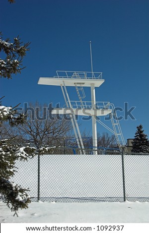 Diving Board Behind Fence in Winter