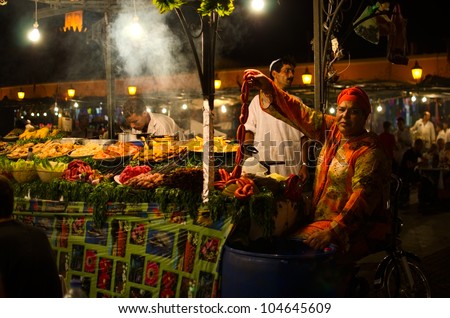 MARRAKESH, MOROCCO - AUGUST 4: Unidentified people at food stands at the Djmaa El Fna place, Marrakech, Morocco on August 4, 2011. During Ramadan, stands are built every day after the sunset and disassembled before the sunrise