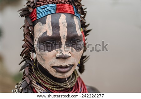 TURMI, Ethiopia, August 12: Unidentified Karo woman wearing natural ornaments in Turmi, Ethiopia, 12, August 2014. The ornament on her head are made by coleoptera wings