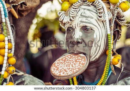 JINKA, ETHIOPIA, - 10 AUGUST 2014: unidentified woman from Mursi tribe with big lip Plate. In the Mursi tribe, the more the lip plate is big, the more the woman is considered beautiful