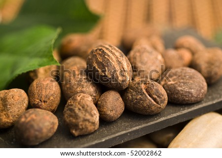 Shea-butter nuts on a brown background