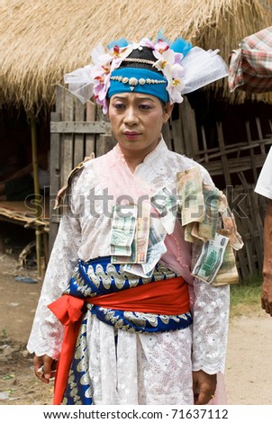 TAUNGBYONE, MYANMAR-AUGUST 28: unknown man dressed to perform dances during Taungbyon Nat Festival, on august 28, 2007. The Nat Festival celebrate the spirits and dancers go into a trance to meet them