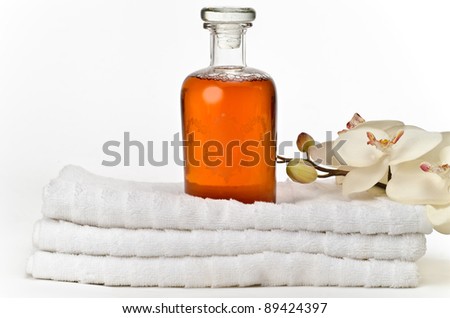 Elegant bottle of bath foam on white