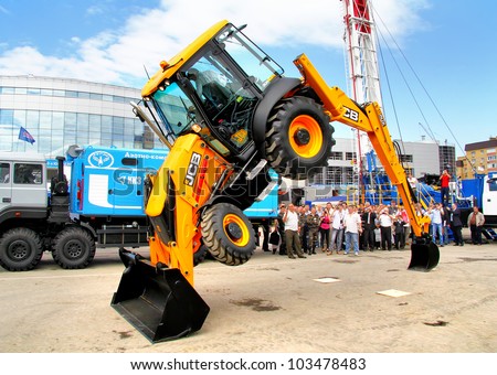 UFA, RUSSIA - MAY 23: Demonstration of of the JCB 3CX tractor abilities at the annual International exhibition 