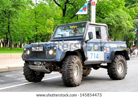 SAINT PETERSBURG, RUSSIA - MAY 25: Oleg Kivkov\'s off-road vehicle Land Rover Defenfer 90 No.714 competes at the annual Ladoga Trophy Challenge on May 25, 2013 in Saint Petersburg, Russia.