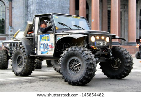 SAINT PETERSBURG, RUSSIA - MAY 25: Vansovics Edvins Juris\'s off-road vehicle Jeep CJ-7 No.406 competes at the annual Ladoga Trophy Challenge on May 25, 2013 in Saint Petersburg, Russia.