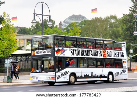 BERLIN, GERMANY - SEPTEMBER 11, 2013: MAN A14 ND202 city sightseeing bus at the city street.