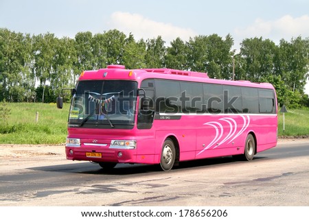 TATARSTAN, RUSSIA - JUNE 14, 2008: Pink Hyundai AeroSpace LD interurban coach at the interurban road.