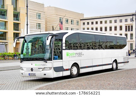 BERLIN, GERMANY - SEPTEMBER 11, 2013: White Mercedes-Benz O580-15RH Travego coach at the city street.