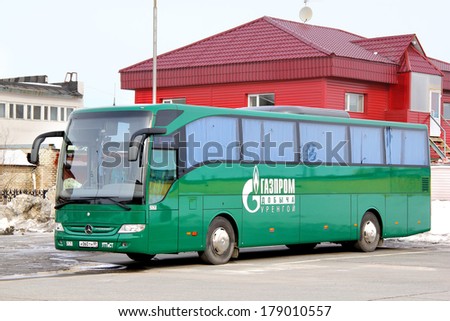 NOVYY URENGOY, RUSSIA - APRIL 20, 2013: Green Mercedes-Benz O350-15RHD Tourismo interurban coach at the bus station.