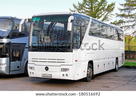 MOSCOW, RUSSIA - MAY 5, 2012: White Mercedes-Benz O350SHD Tourismo interurban coach at the city street.