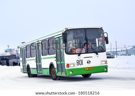 NOVYY URENGOY, RUSSIA - FEBRUARY 9, 2013: White and green LIAZ 5256 city bus at the city street.
