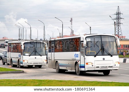 NOVYY URENGOY, RUSSIA - SEPTEMBER 17, 2012: White KAVZ 4238 Aurora interurban coaches at the city street.