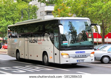 BERLIN, GERMANY - SEPTEMBER 12, 2013: White Setra S415GT-HD interurban coach at the city street.