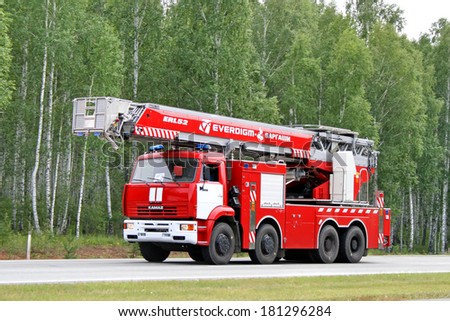 CHELYABINSK REGION, RUSSIA - AUGUST 14, 2009: Red KAMAZ fire ladder at the interurban road.