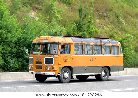 KRASNODAR KRAI, RUSSIA - JULY 17, 2009: Yellow PAZ 672M vintage bus at the interurban road.