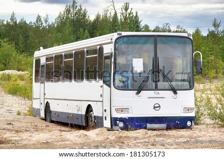 YAMAL, RUSSIA - AUGUST 8, 2013: Deserted LIAZ 5256 interurban coach at the roadside.