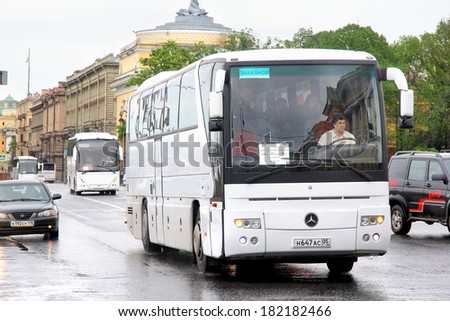 SAINT PETERSBURG, RUSSIA - MAY 26, 2013: White Mercedes-Benz O350RHD Tourismo interurban coach at the city street.