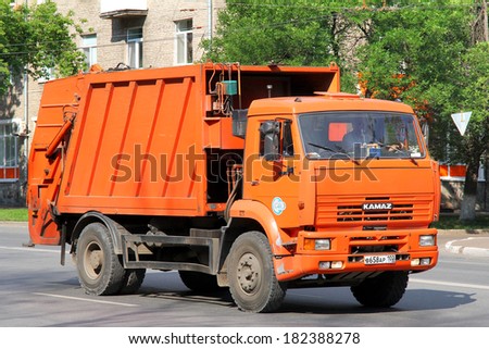 UFA, RUSSIA - JUNE 25, 2012: Orange KAMAZ 53605 garbage truck at the city street.