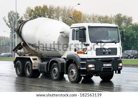 UFA, RUSSIA - SEPTEMBER 9, 2008: White MAN TGA concrete mixer truck at the city street.