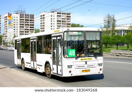 YEKATERINBURG, RUSSIA - MAY 8, 2010: White NEFAZ 5299 city bus at the city street.
