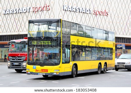 BERLIN, GERMANY - SEPTEMBER 10, 2013: Yellow MAN A39 Lion\'s City DD double-decker bus of Berliner Verkehrsbetriebe bus company at the city street.